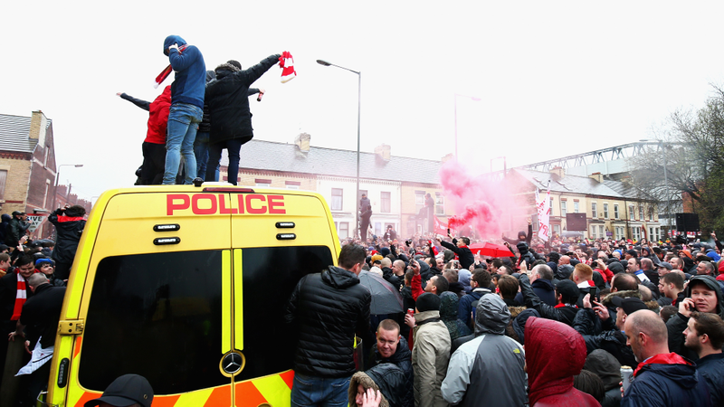 Illustration for article titled Liverpool Fans Get Rowdy, Hop On Police Vans